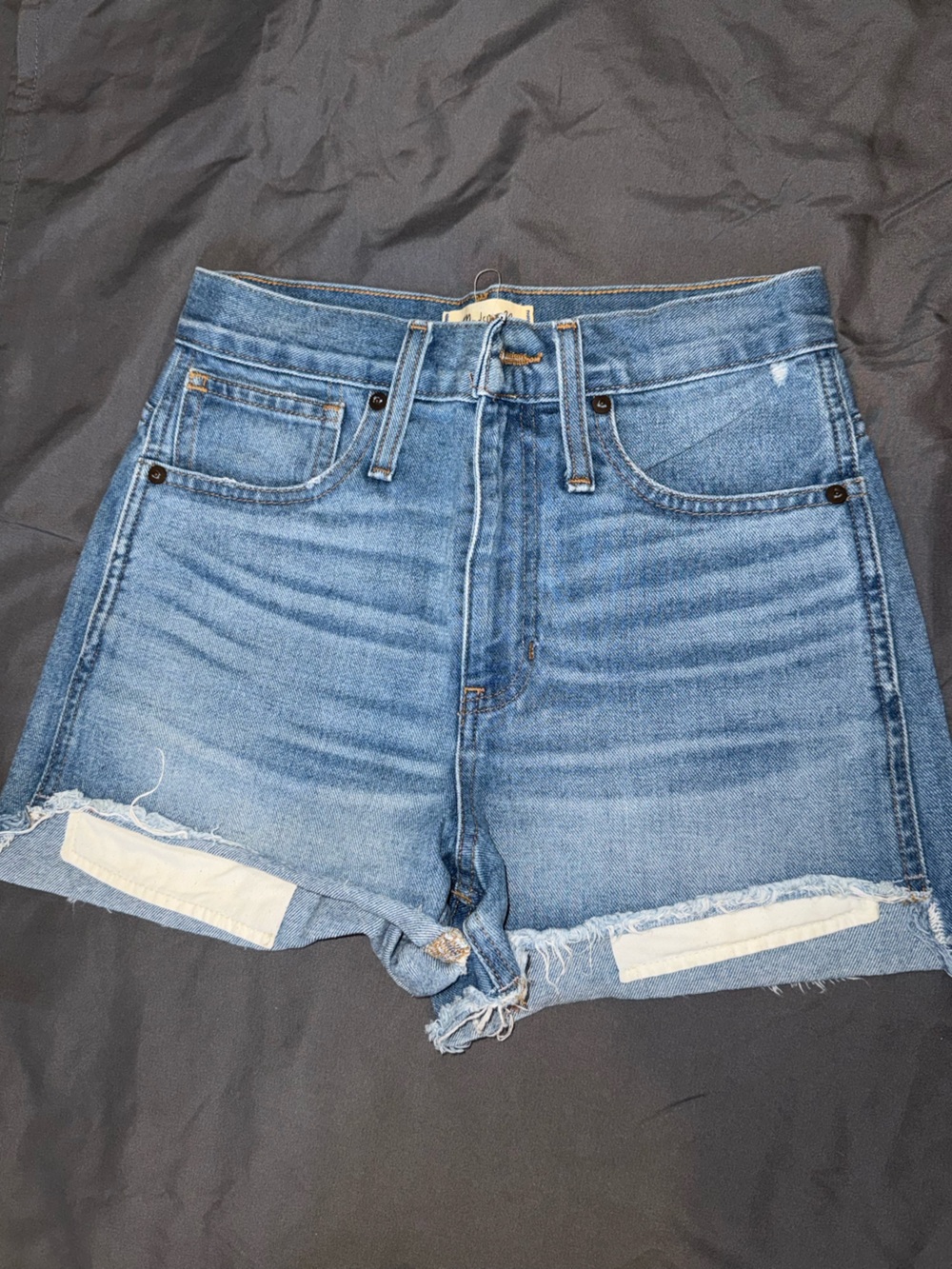Madewell blue denim jeans with cream label